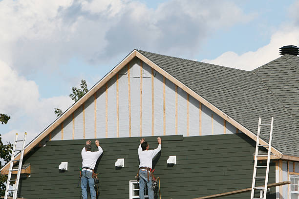 Professional Storm Damage Siding Repair technician working in Niles, IL
